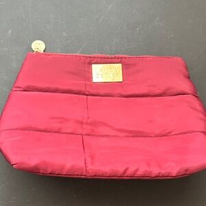 Laura Geller maroon cosmetic bag
